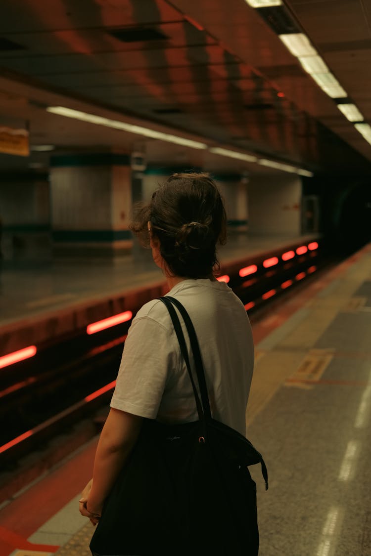 Woman On Platform Of Metro Station