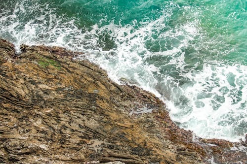 Sea Waves Splashing against Cliff