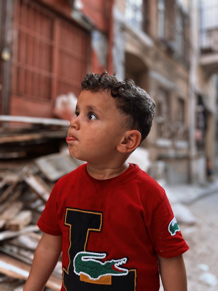 Boy In City Making Face