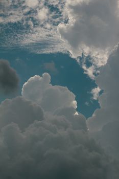Beautiful cumulus clouds with contrasting blue sky on a cloudy day.
