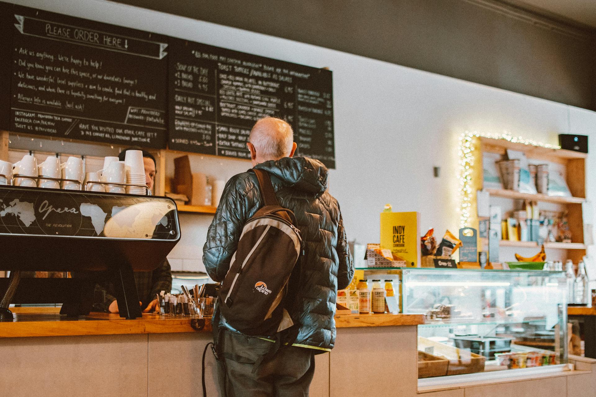 Man Standing In Front Of Counter