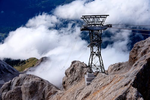 A Utility Pole on Top of a Rocky Mountain 