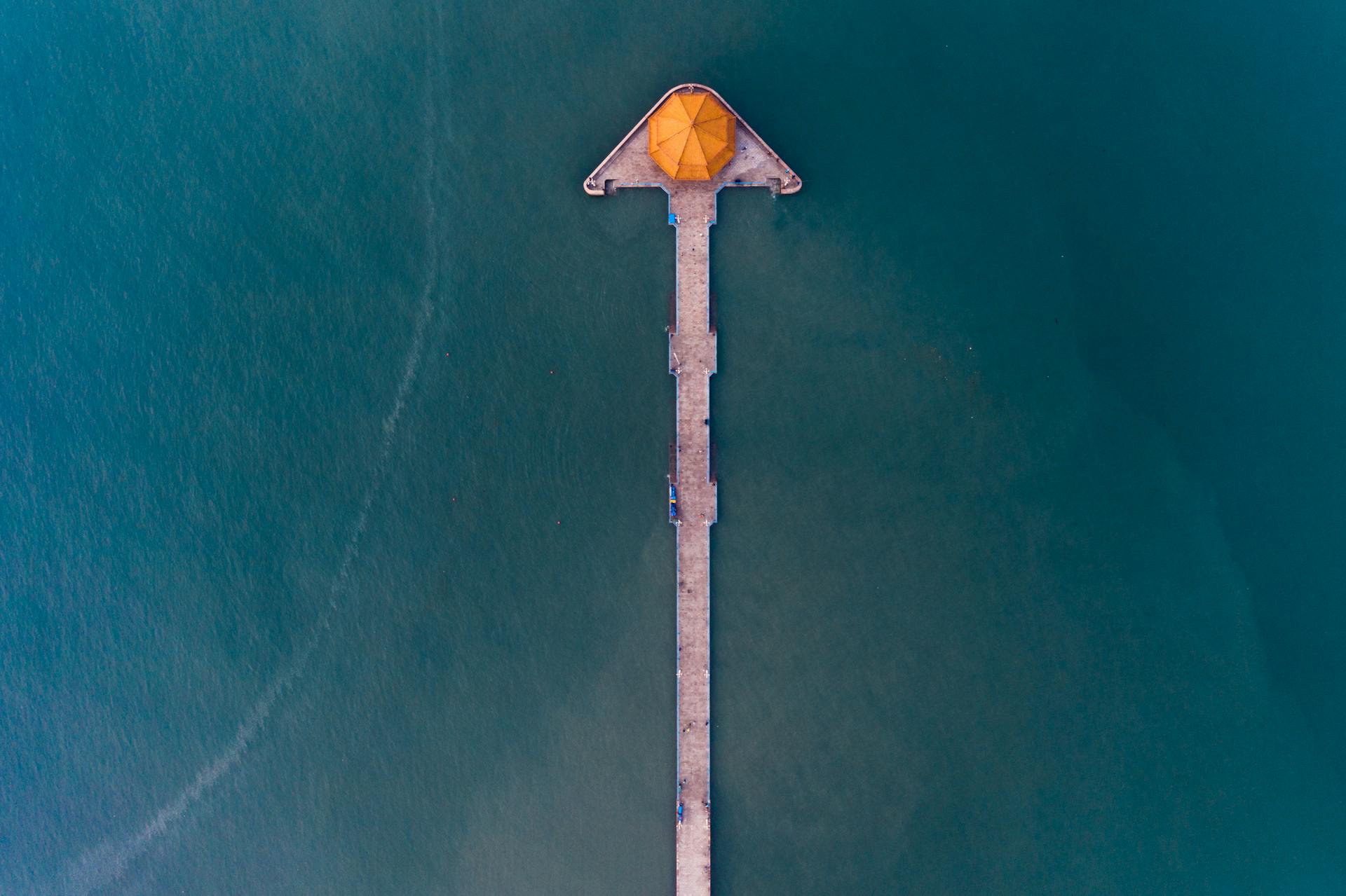 Umbrella on Pier on Sea Shore