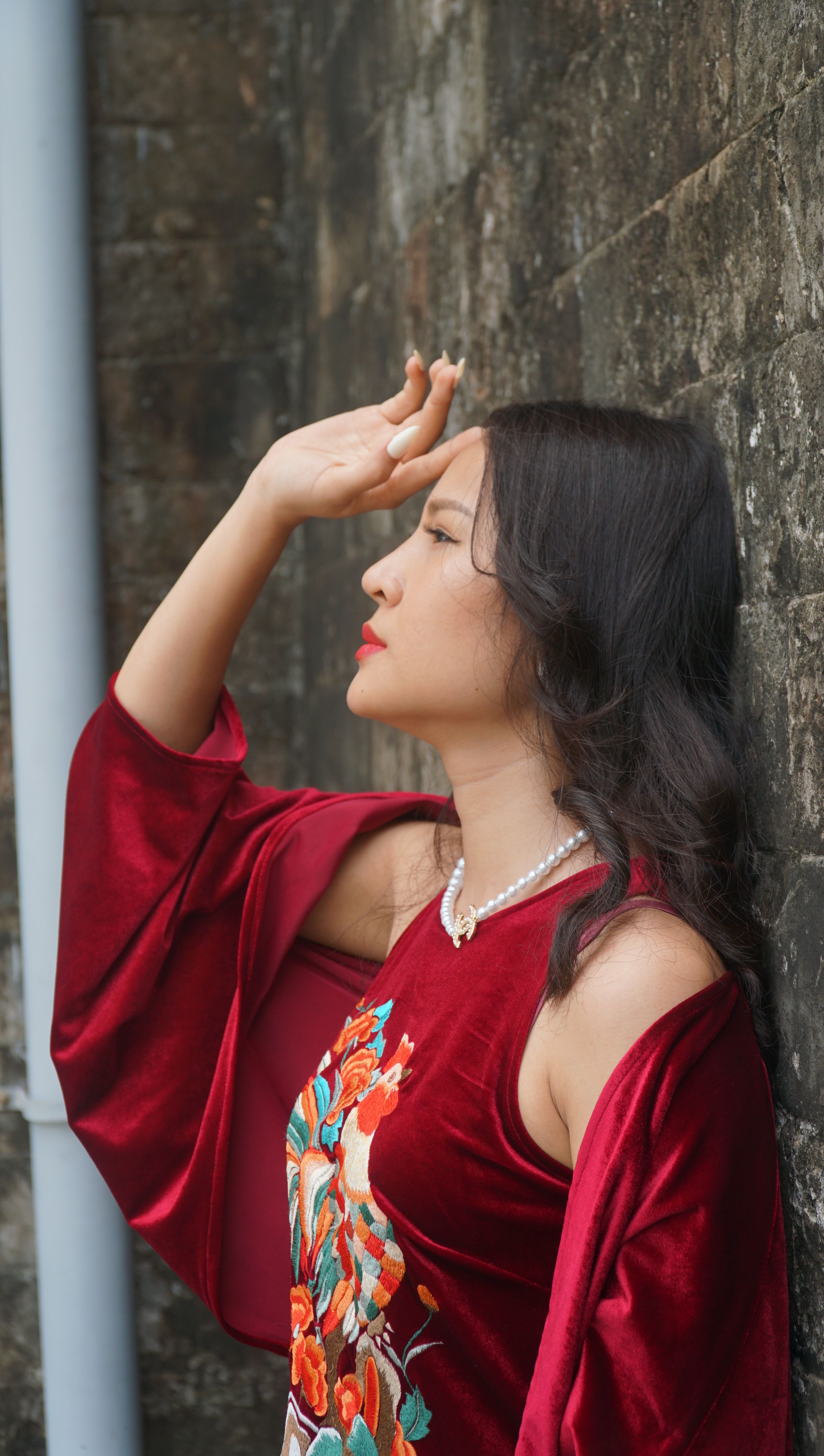 Young Woman in a Red Dress Posing Outside · Free Stock Photo