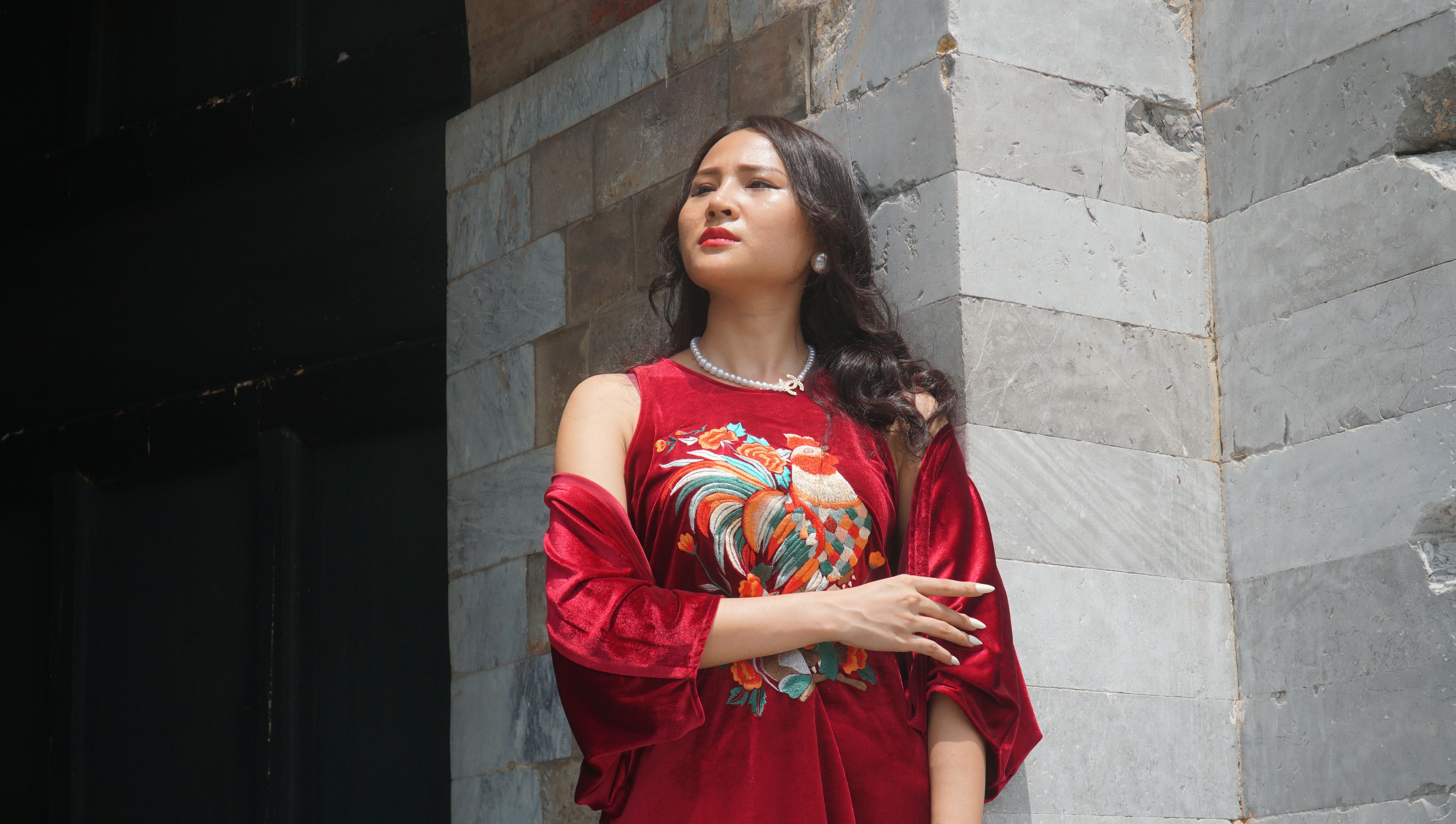 Elegant Woman in a Red Dress Posing Outside · Free Stock Photo