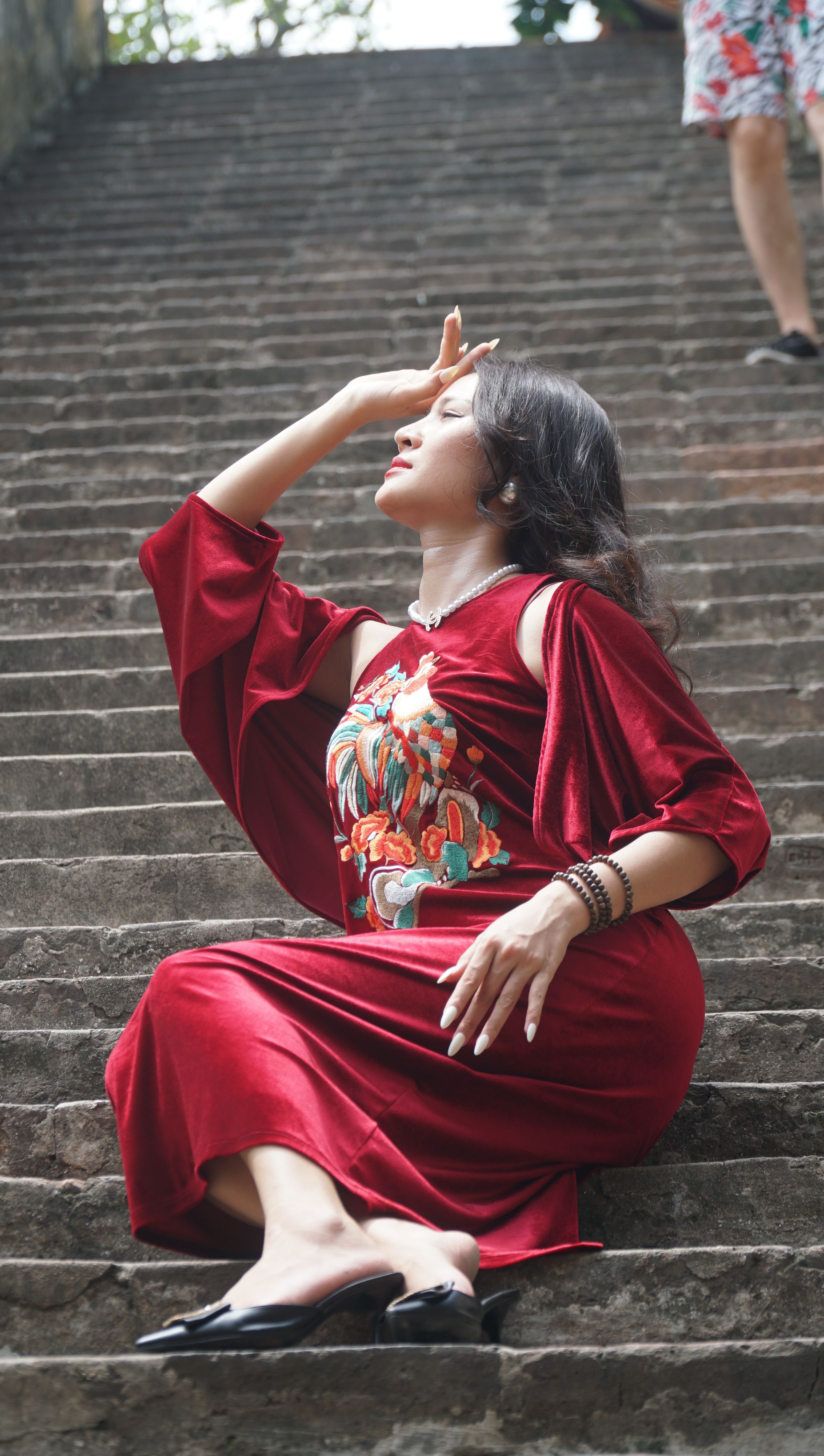 Young Woman in a Red Dress Posing Outside · Free Stock Photo