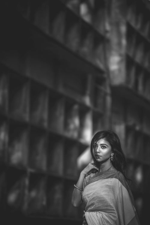 Free Stylish monochrome portrait of a woman in traditional attire with a thoughtful pose. Stock Photo