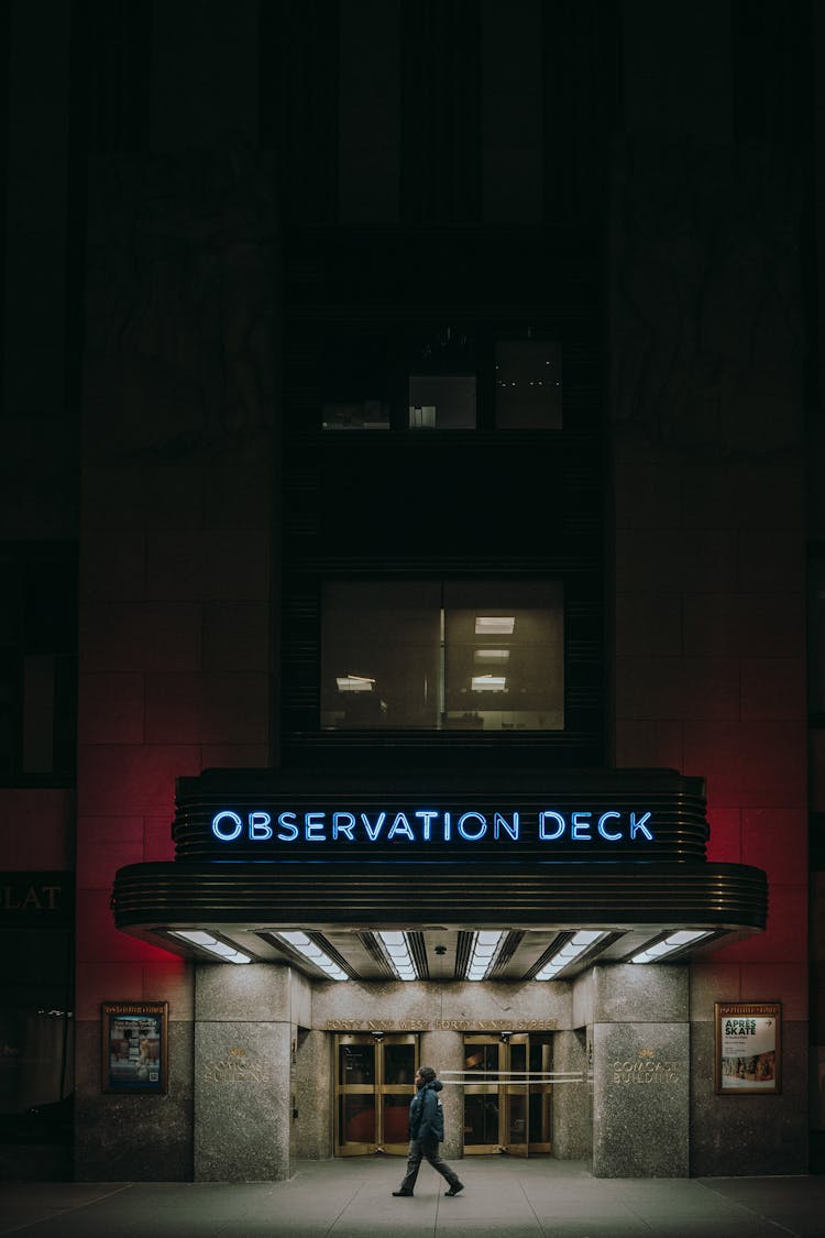 Person Walking Near Observation Deck Entrance At Night