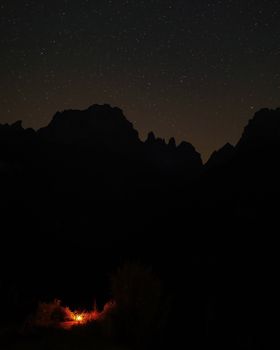 Stunning starry night over a campsite in Trentino-Alto Adige, Italy.