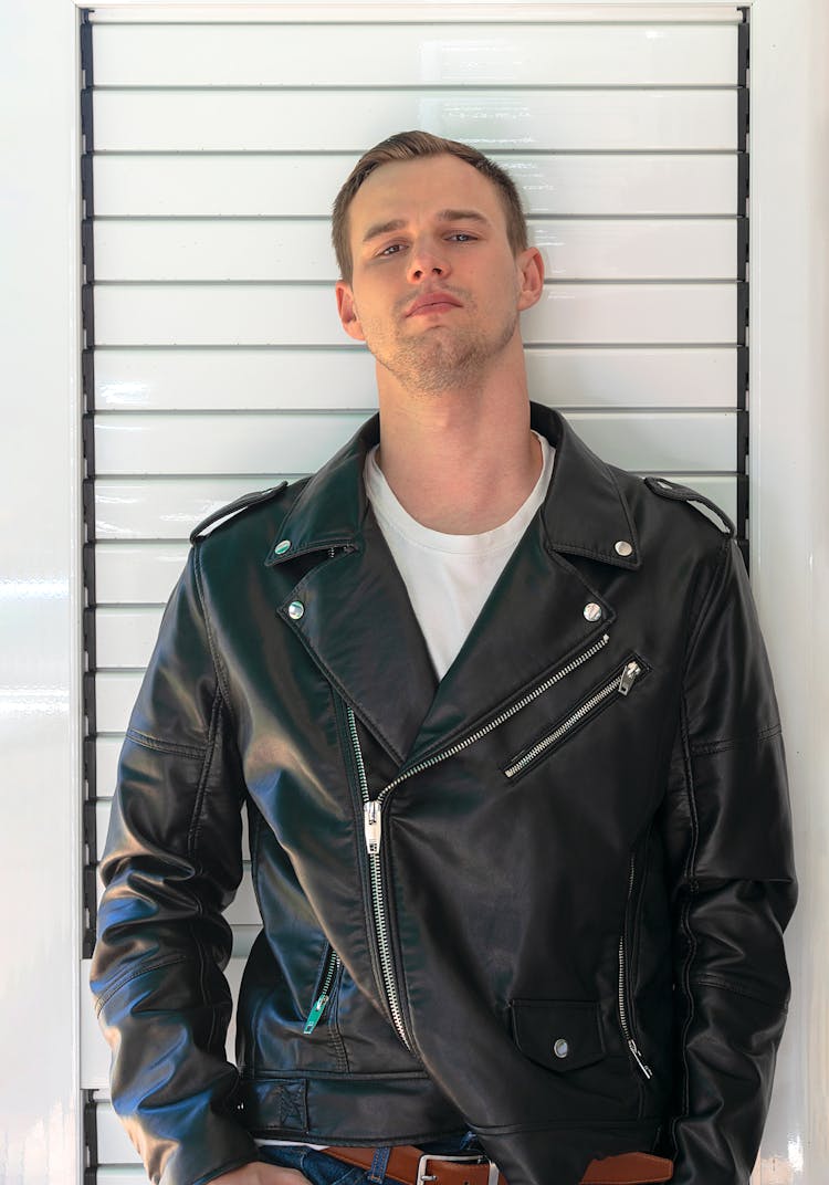 Young Man Posing In Black Leather Biker Jacket 