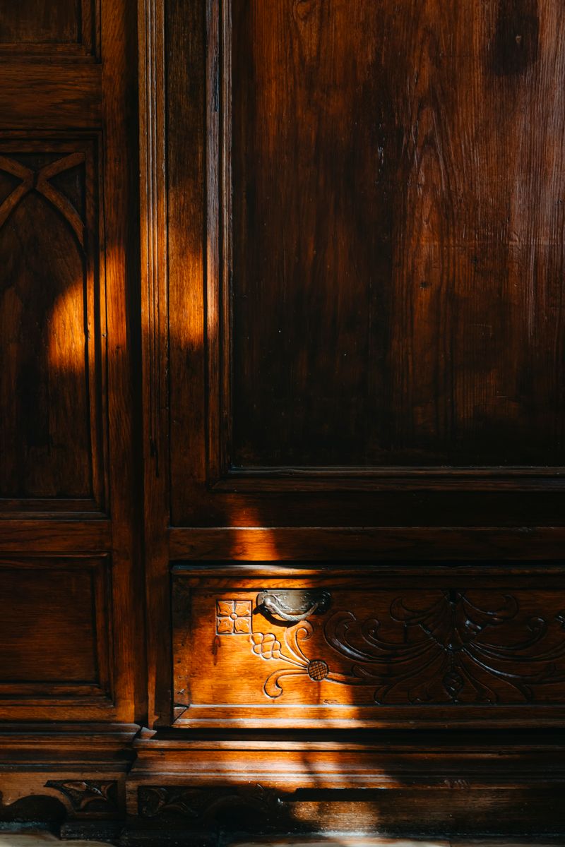 Vintage wooden wardrobe with intricate carvings