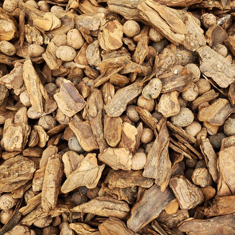 Close-up of raw wood bark and pellet material showing natural texture