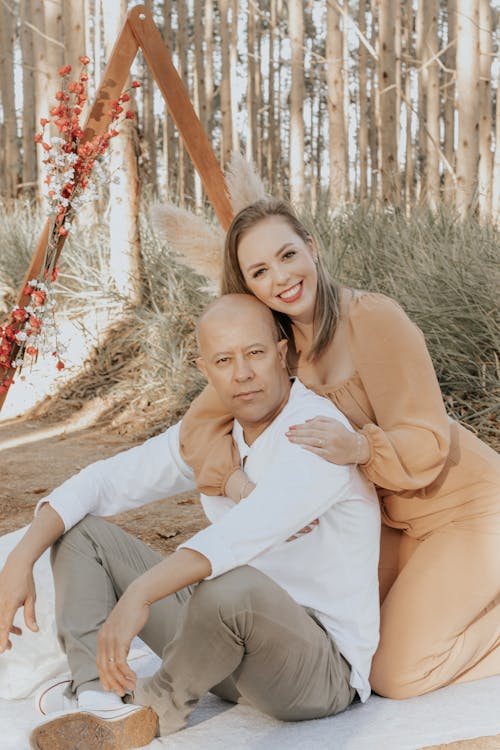 Smiling Couple Sitting Together