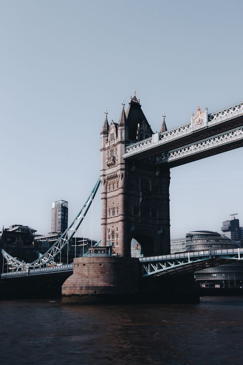 Free Iconic Tower Bridge spanning the River Thames, highlighting London's historic architecture. Stock Photo