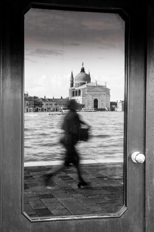 Reflection of Church in Venice and Walking Person