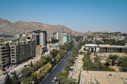 Free Stunning aerial view of Kabul, Afghanistan, showcasing urban sprawl and surrounding mountains. Stock Photo