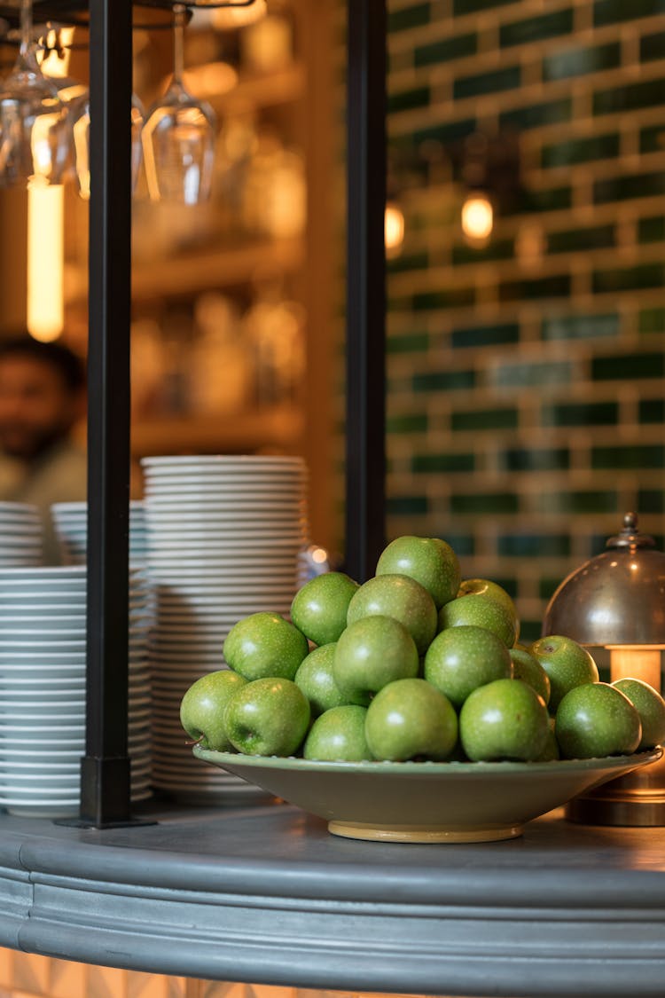 Plate Of Apples On Bar Counter