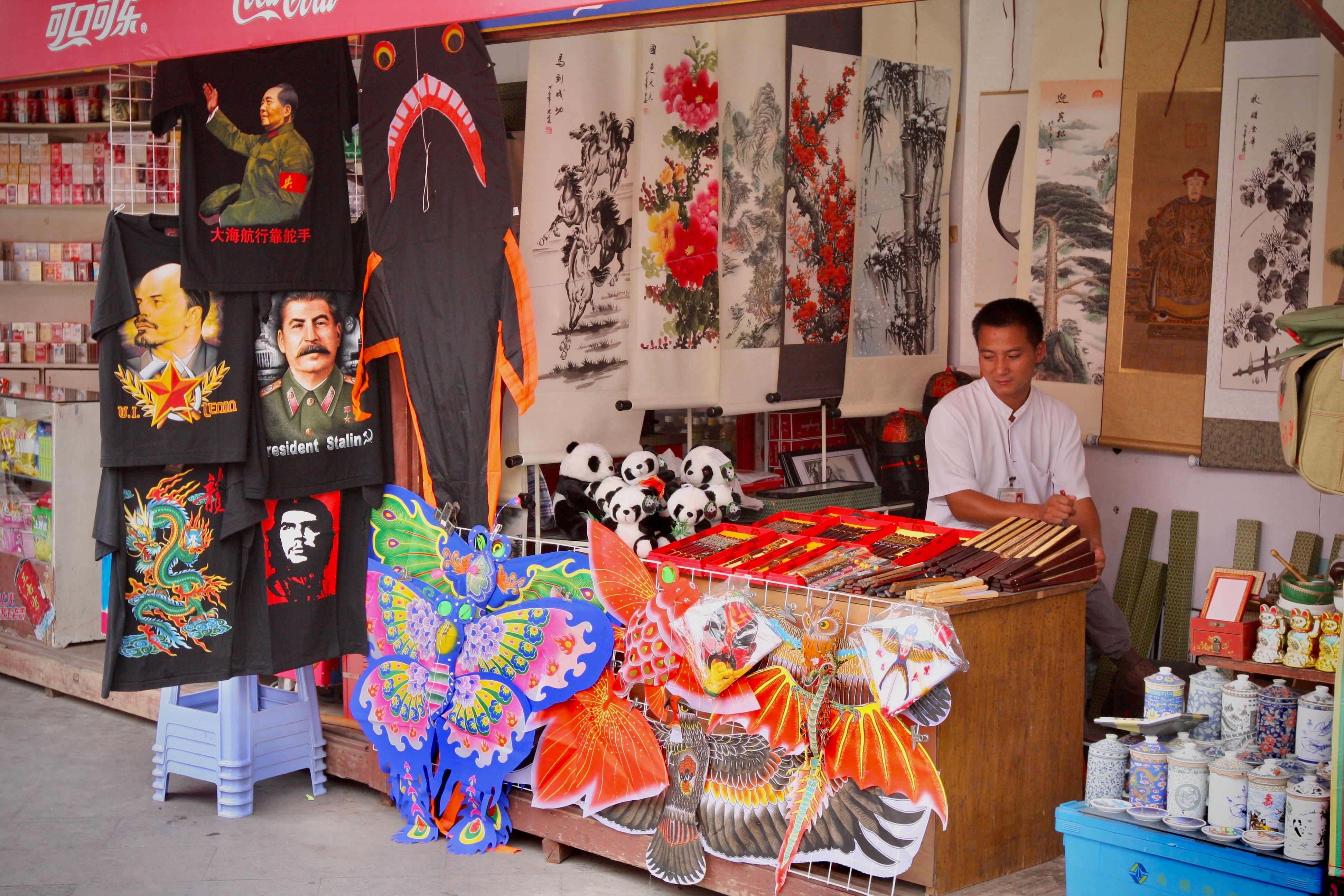 Colorful Chinese market stalls with silk and souvenirs — detail