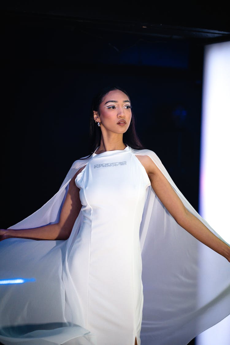 Woman Wearing White Dress On A Fashion Show