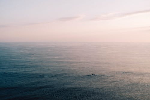 Boats on the Ocean at Dawn