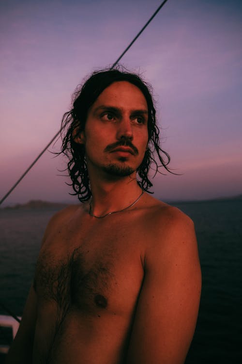 Bare Chested Man on the Sea