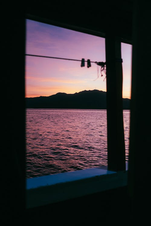 Silhouette of Mountains Seen from Ship Deck