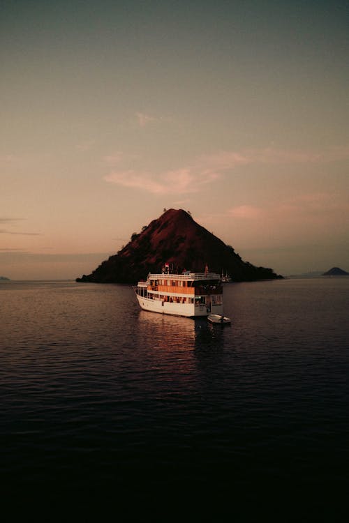 Ferry Sailing on Sea by Rocky Island