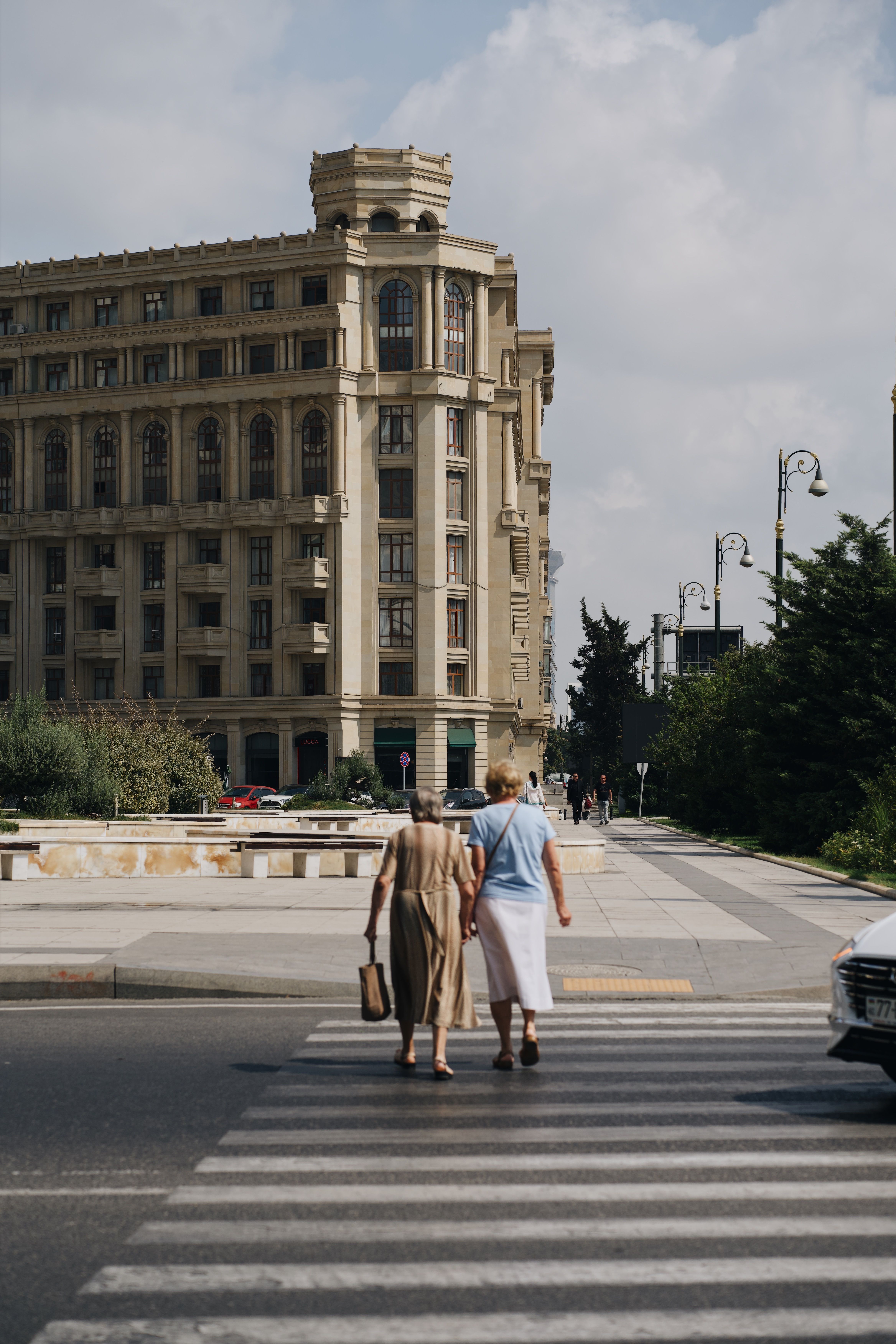 Two Women Crossing the Road · Free Stock Photo