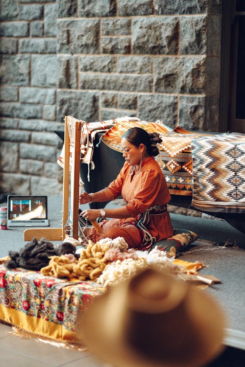 Woman Weaving Textiles on Street