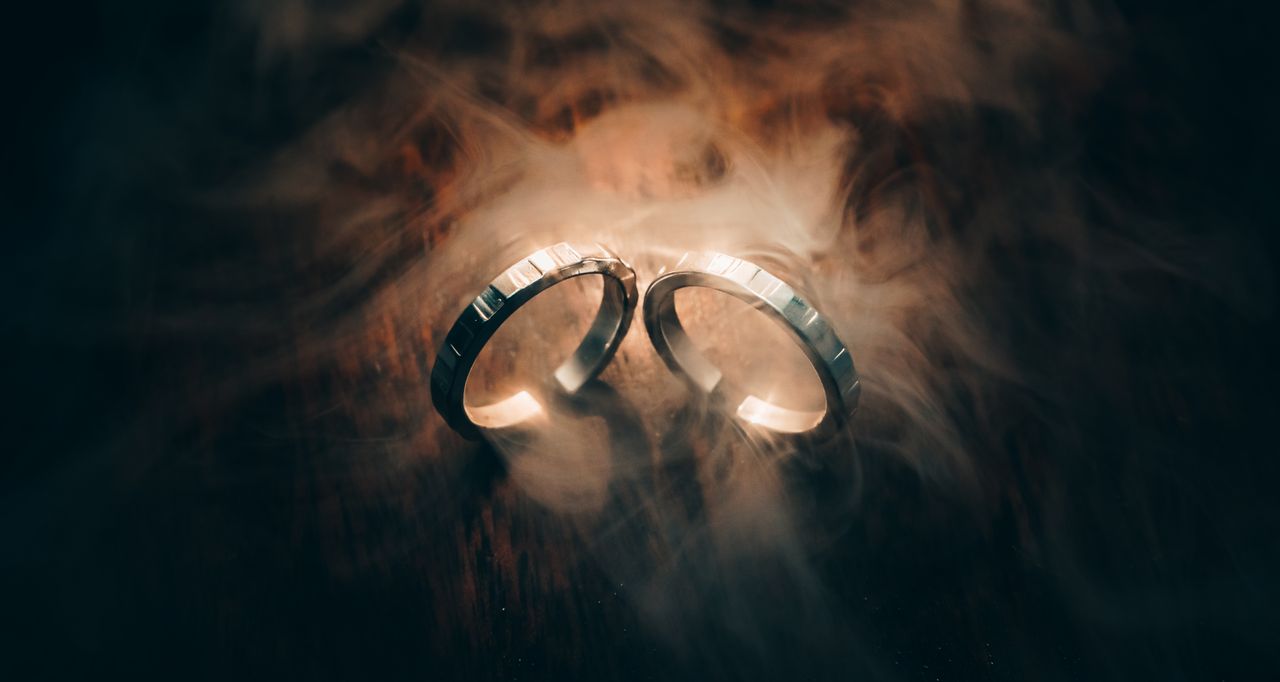 two silver rings surrounded by mystical smoke creating an ethereal and