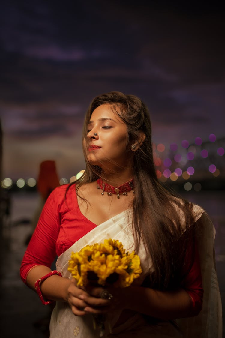 Portrait Of Woman With Flowers At Night