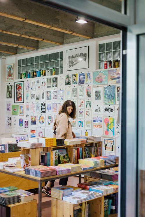 Free Explore a vibrant bookstore in Bratislava with colorful art and cozy ambience. Stock Photo
