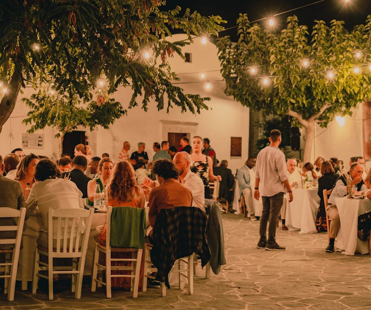 People Dining In A Restaurant Patio