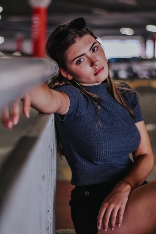 Woman Lean on Concrete Surface