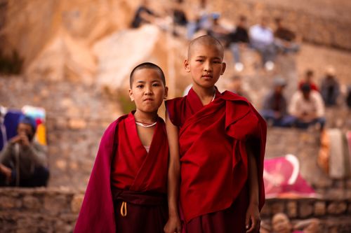 Free Two young Buddhist monks in red robes captured outdoors in HP, India. Stock Photo