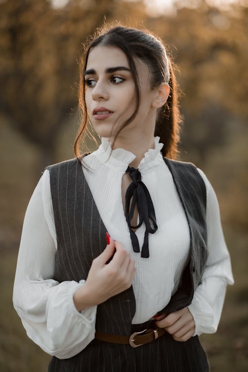 Elegant Woman Posing Outside in Autumn