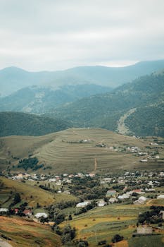 Scenic aerial view of the Kədəbək countryside in Azerbaijan with rolling hills and charming villages.
