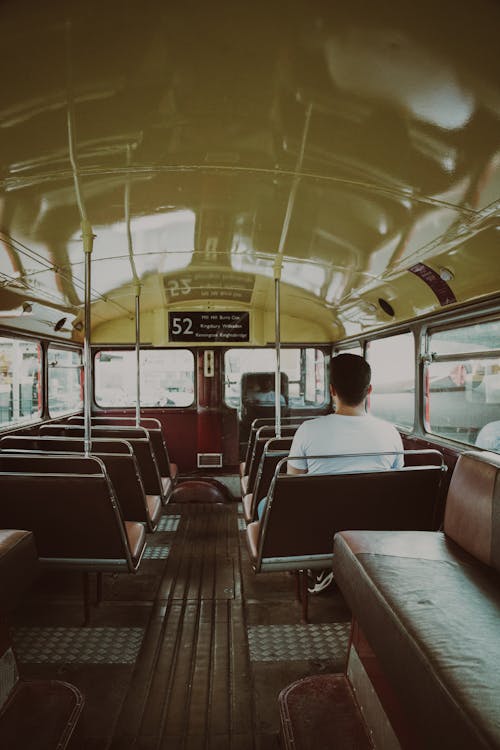 Passenger Sitting in an Old Public Transport Bus