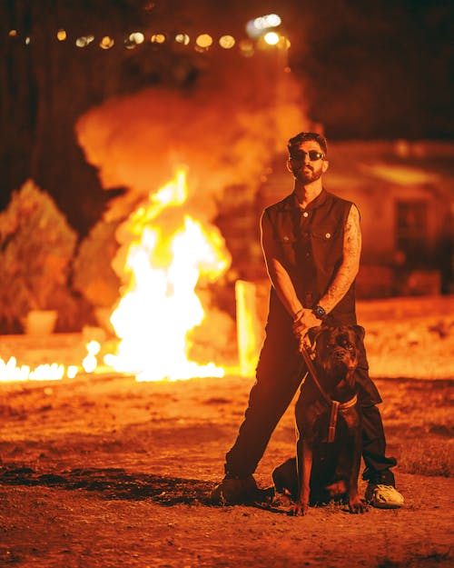 Fire behind Man with Dog