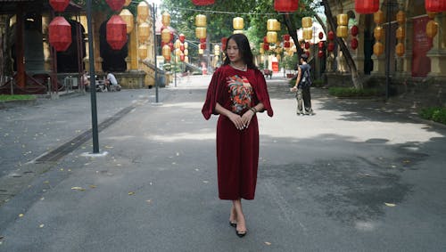 Elegant Woman in Red Dress on Street