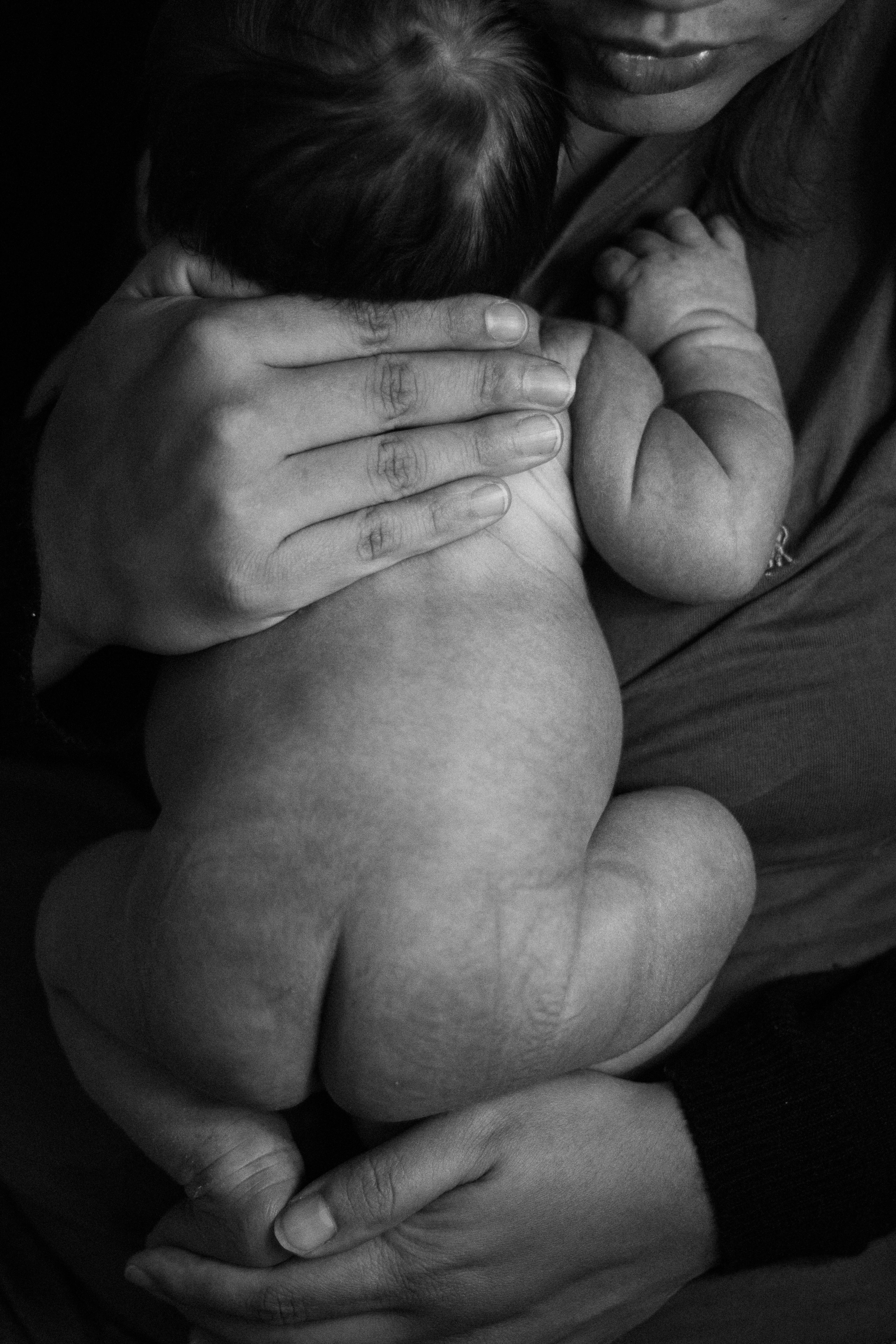 mother hands holding baby