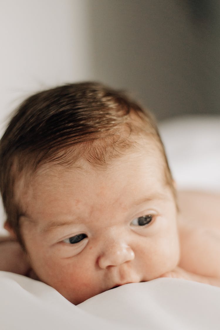 Face Of Baby Lying Down