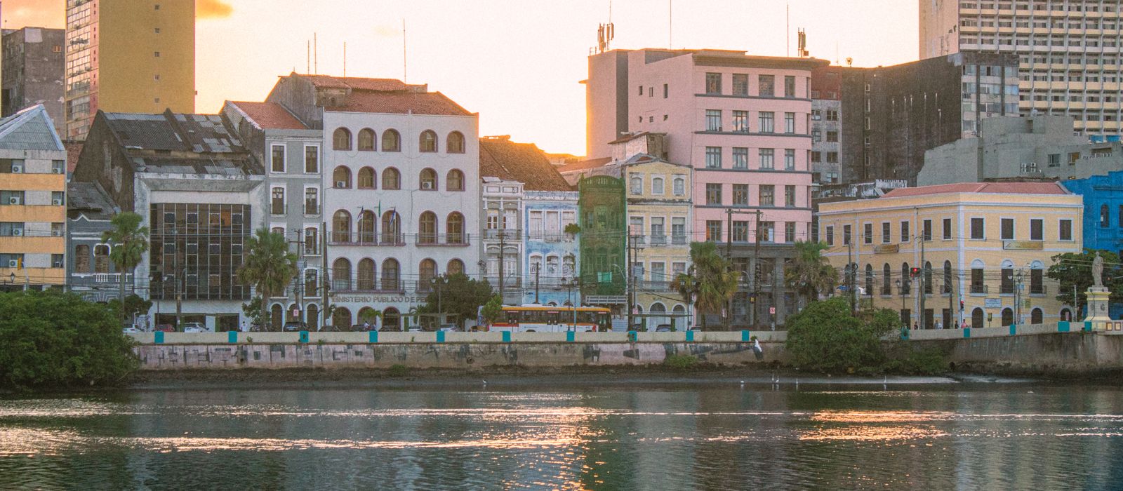 Beautiful sunset view of Recife's historic riverside architecture reflecting on the water. — flights from Madrid to Recife