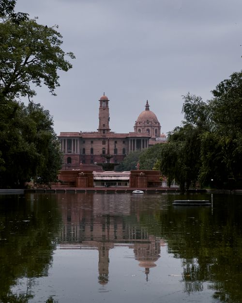 Free View of the Central Secretariat with reflection in the water, New Delhi. Stock Photo
