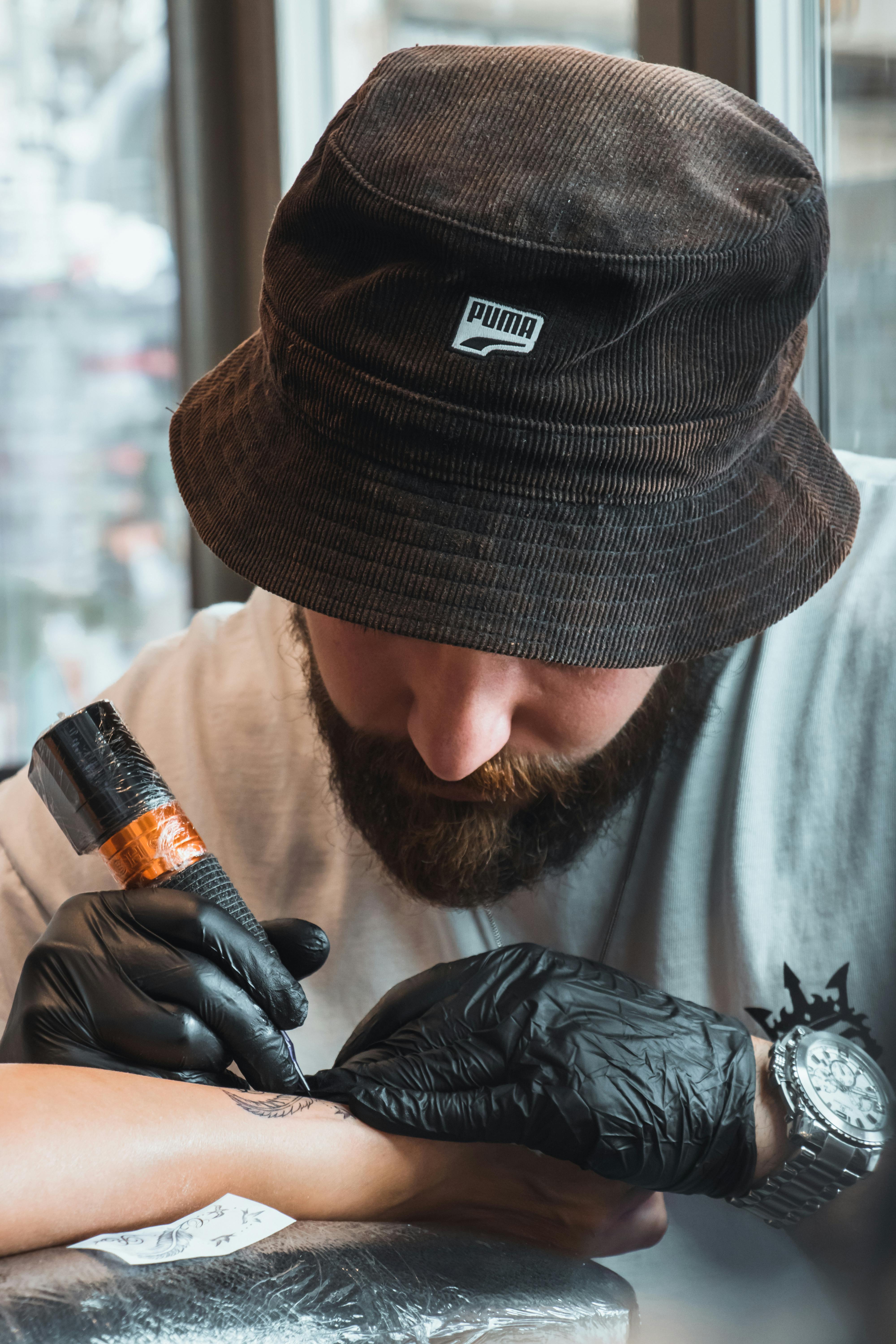 Tattoo artist focused on creating intricate design in Aydın, Türkiye.