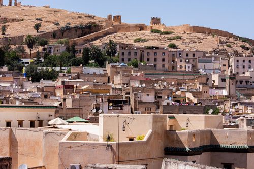 Free Scenic view of Fez, Morocco showcasing historical architecture and city walls. Stock Photo