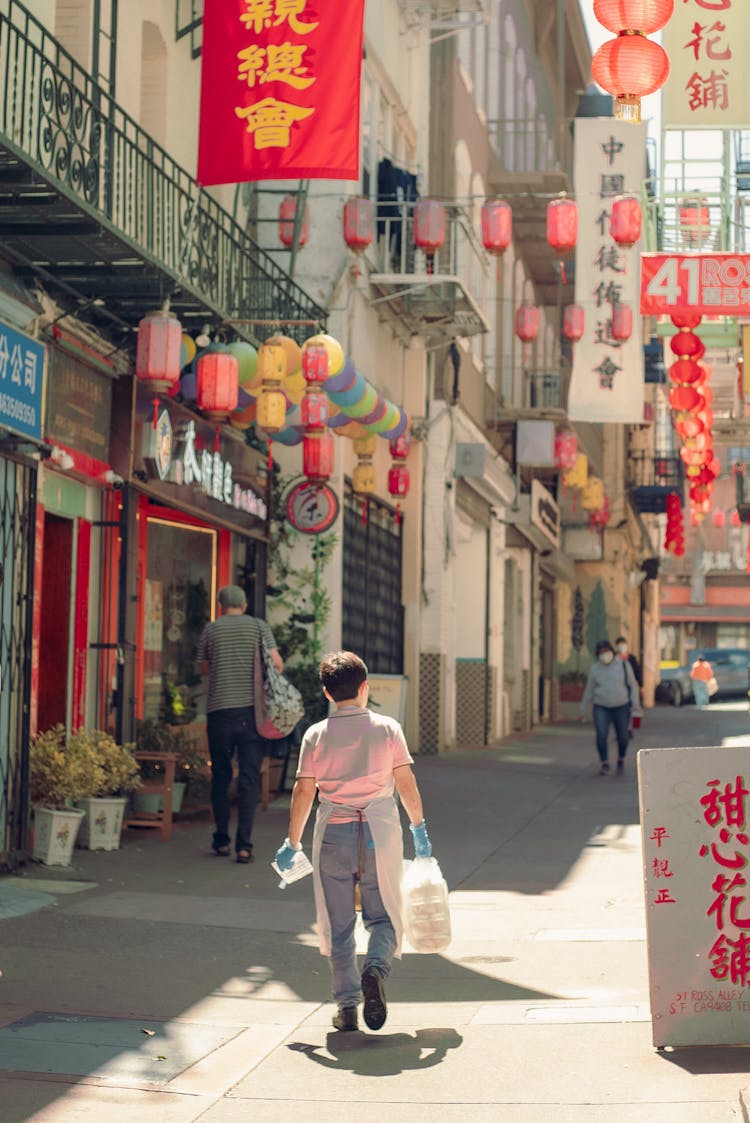 Woman Carrying Bag On Street