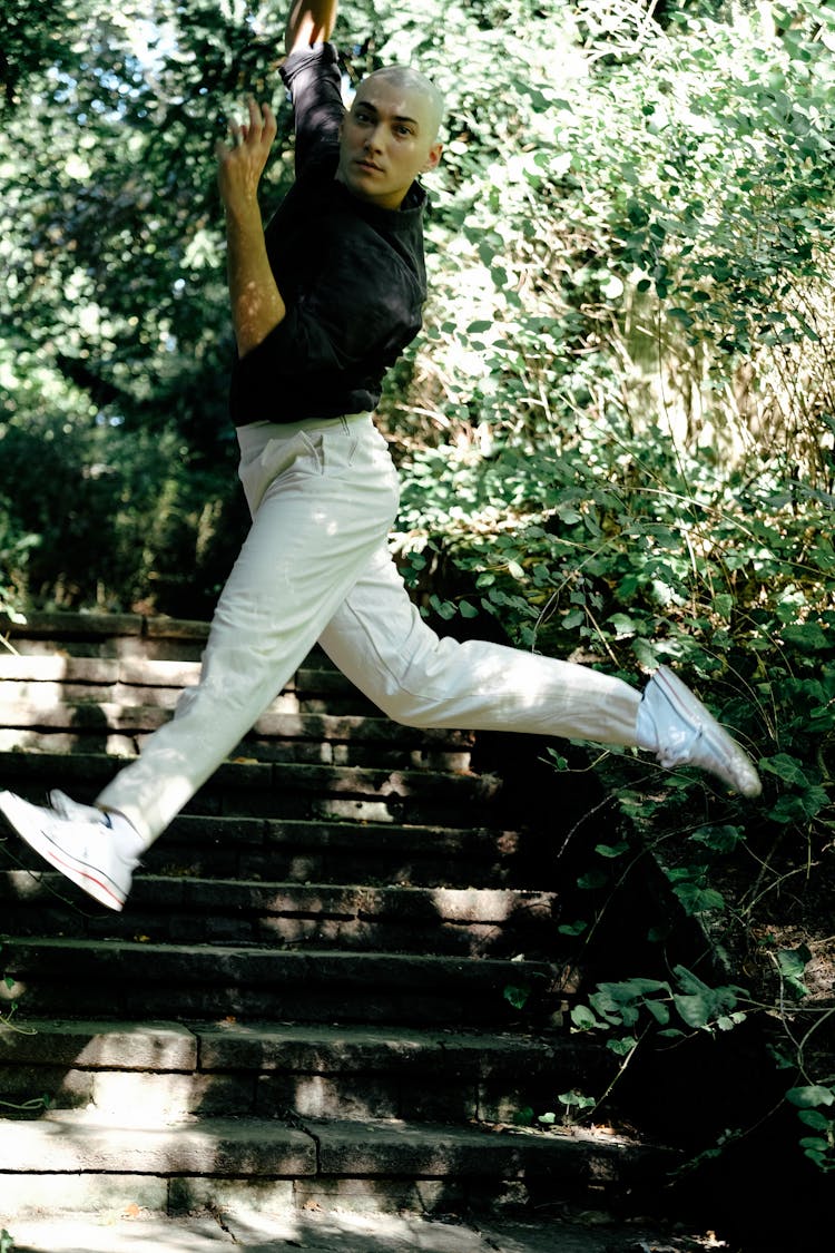 Handsome Man Jumping In The Park