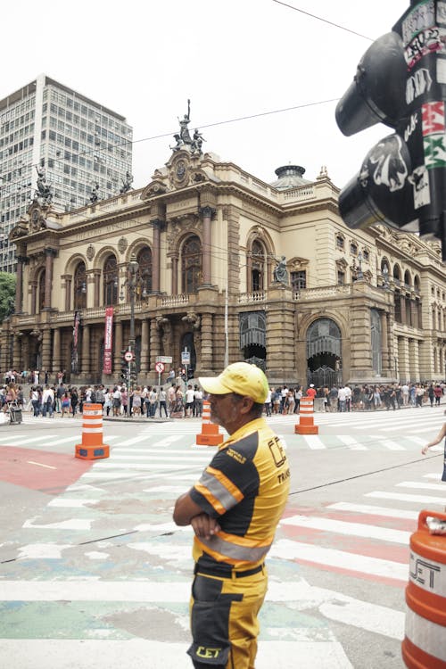 Man Standing Near Traffic Light