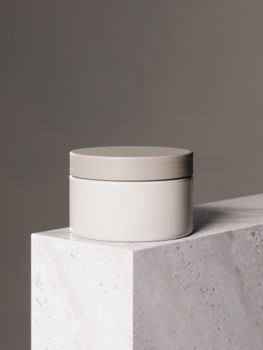 Elegant white jar with gray lid on marble, perfect for beauty and lifestyle products.